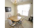 Traditional dining room with a chandelier and a bright window allowing natural light at 2918 Egret Ln, Austell, GA 30106