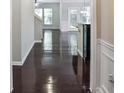 Inviting hallway with gleaming hardwood floors leading to a bright and open living area at 2948 Goldfinch Cir, Marietta, GA 30066