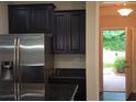 Kitchen features modern stainless steel appliances, granite countertops, and dark cabinets at 2948 Goldfinch Cir, Marietta, GA 30066