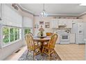 Bright breakfast nook featuring white appliances, a round table, and natural light at 1593 Poplarwood Lane Northwest Ln, Lawrenceville, GA 30043