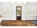 Bright foyer featuring hardwood floors, natural light, and elegant trim at 1596 Fearn Ne Cir, Brookhaven, GA 30319