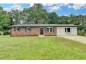 Charming brick home with well-manicured lawn and updated landscaping at 3799 Sweetbriar Cir, Lithia Springs, GA 30122
