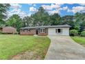 Charming brick home with well-manicured lawn and updated landscaping at 3799 Sweetbriar Cir, Lithia Springs, GA 30122
