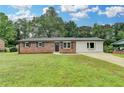 Charming brick home with well-manicured lawn and updated landscaping at 3799 Sweetbriar Cir, Lithia Springs, GA 30122