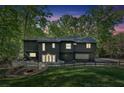 Expansive backyard with fire pit and seating area, perfect for outdoor entertaining at 510 Watergate Ct, Roswell, GA 30076