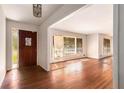 Bright living room with polished hardwood floors and large windows at 2386 Springrun Way, Decatur, GA 30032