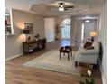 Inviting living room boasts an open layout with a large window for natural light and stylish decor at 1221 St James Pl, Loganville, GA 30052