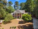 Traditional home featuring mature trees and beautiful landscaping, adding to its curb appeal at 2595 Winthrope Way, Lawrenceville, GA 30044