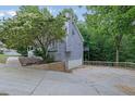 View of the house with a basement garage and an elevated outdoor deck at 402 Wood Chase Ln, Canton, GA 30114