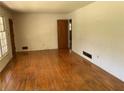 Inviting living room with hardwood floors, great natural light, and a classic interior design at 2703 Arrowood Dr, East Point, GA 30344