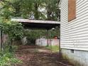 View of the backyard showing a chain link fence and a covered carport at 449 Hamilton E Holmes Nw Dr, Atlanta, GA 30318