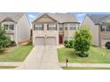 Beautiful two-story house with brick and siding, a two-car garage, and a well-kept front lawn at 556 Emporia Loop, Mcdonough, GA 30253