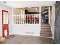 Cozy entryway with view of the kitchen and red accents and barn door at 2592 King Louis Ne Rd, Conyers, GA 30012