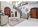 Grand foyer showcases soaring ceilings, elegant staircase, and marble floors, creating a striking first impression at 4309 Sentinel Post Nw Rd, Atlanta, GA 30327