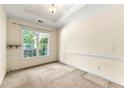 Bright bedroom featuring a large window providing ample natural light and plush carpeting at 2001 Macland Square Dr # 11, Marietta, GA 30064