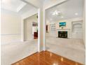Spacious living room with fireplace and built-in shelving, showcasing seamless transition to adjacent dining space at 2001 Macland Square Dr # 11, Marietta, GA 30064