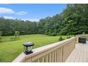 View from the deck overlooking a spacious, green backyard surrounded by lush trees and with privacy at 4746 Mulberry Rock Rd, Dallas, GA 30157