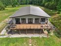 An aerial view of a stylish home boasting a large deck and expansive outdoor space at 1971 Centennial Rd, Rutledge, GA 30663