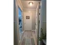 Neutral hallway showcases modern floors, fresh paint, and leads to inviting living spaces at 6851 Roswell Rd # D33, Atlanta, GA 30328