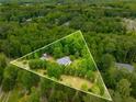 Expansive aerial view of a secluded property surrounded by lush greenery at 999 Bailey Rd, Woodstock, GA 30188