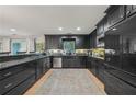 Modern kitchen features granite countertops, stainless steel appliances and ample cabinet storage at 2762 Whispering Pines Dr, Decatur, GA 30033