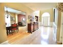 Spacious foyer with hardwood floors and views of the dining and living areas at 318 Ivy Manor Nw Dr, Marietta, GA 30064