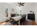 The dining room is equipped with an ornate rug, and a fireplace at 220 Riverview Trl, Roswell, GA 30075