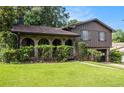 Inviting home featuring brick archways and mature landscaping surrounding the front entrance at 2209 Willoby Ct, Morrow, GA 30260