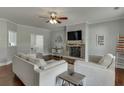Cozy living room featuring a stone fireplace and comfortable seating at 440 S Alexander St, Buford, GA 30518