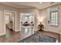 Elegant entryway showcasing an open floor plan, hardwood floors, and a glimpse into the bright, inviting living room at 221 Thompson St, Alpharetta, GA 30009