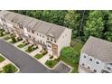 Aerial view of townhomes showcasing well-manicured lawns and a beautiful community at 893 Society Sw Cir, Atlanta, GA 30331