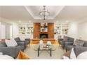 Cozy living room featuring a brick fireplace, built-in bookshelves, and plush seating at 186 Mt Calvary Rd, Marietta, GA 30064