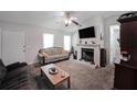 Inviting living room featuring a cozy fireplace, neutral carpet floors and a light gray color scheme at 359 Dallas St, Hiram, GA 30141