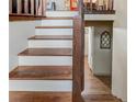 Interior view of staircase featuring wooden steps and trim with a hallway below at 317 Hoofbeat Ne Trl, Kennesaw, GA 30144