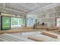 A spacious living room with large sliding glass doors leading to the outdoor space, offering seamless indoor-outdoor living at 4608 Kings Down Rd, Atlanta, GA 30338