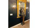 Hallway features a decorative gold mirror with antique clock and stylish sconce lighting at 3180 Mathieson Drive # 502, Atlanta, GA 30305