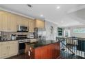 Spacious kitchen with stainless steel appliances, light cabinets, and dark hardwood floors at 1786 Dekalb Ne Ave, Atlanta, GA 30307