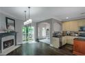 Open concept living room with fireplace and access to outdoor deck, seamlessly connected to the kitchen at 1786 Dekalb Ne Ave, Atlanta, GA 30307