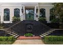 Elegant home entrance featuring dual stairways and a decorative lion fountain at 21 Barksdale Ne Dr, Atlanta, GA 30309