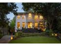 Charming two-story home with a well-lit exterior and lush front lawn at 21 Barksdale Ne Dr, Atlanta, GA 30309