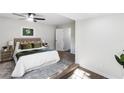 Bright, stylish bedroom features a plush bed, modern decor, and ample natural light at 389 Oglesby Bridge Se Rd, Conyers, GA 30094