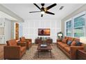 Stylishly furnished living room with hardwood floors, custom wall paneling, and lots of natural light at 4808 Oak Ct, Ellenwood, GA 30294