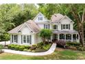 Inviting home with manicured lawn and lush landscaping, with a welcoming front porch and classic design at 5258 Tallgrass Nw Way, Kennesaw, GA 30152