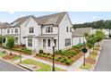 Well-maintained two-story home featuring neat landscaping and a sidewalk in a friendly neighborhood at 993 Harvest Park Ln, Suwanee, GA 30024