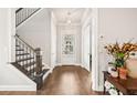 Inviting foyer with hardwood floors and staircase, providing a warm welcome to the home at 993 Harvest Park Ln, Suwanee, GA 30024