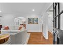 Bright living room with hardwood floors, white walls, and open doorway at 1291 Stillwood Ne Dr, Atlanta, GA 30306