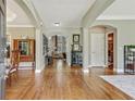 Spacious foyer featuring hardwood floors and decorative molding, offering a grand entrance to the home at 2073 Woodside Park Dr, Woodstock, GA 30188