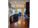 Spacious kitchen featuring stainless steel appliances and dark wood cabinets at 3897 Valley Bluff Ln, Snellville, GA 30039