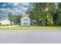 Charming two-story home with lush lawn and tasteful stone accents, blending modern comfort with natural beauty at 1111 Fieldgate Rd, Lawrenceville, GA 30044
