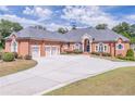 Stately brick home with a three-car garage and circular driveway at 2740 Bountiful Pl, Lawrenceville, GA 30045
